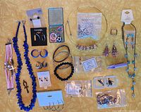 Full layout of jewellery pieces on yellow background