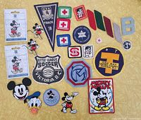 All patches laid out showing variety and Disney items