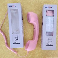 Two boxed NFXSL pink phone handsets with one handset displayed
