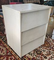 Front and side view of painted wood dresser
