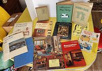Group shot of all books spread on yellow table