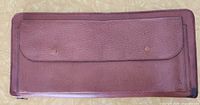 Exterior of brown leather zippered travel case