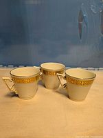 Three Burleigh Zenith tea cups front view showing pattern and handles
