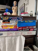 Stack of assorted food-wrap boxes on table