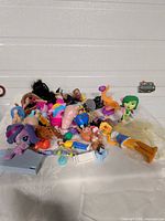 Pile of assorted small toys on table