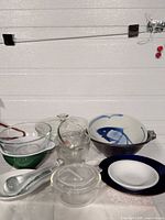 Group shot of all kitchenware pieces: ceramic, glass, spoon, ladle