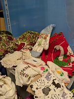 Group shot showing assortment of linens in bin