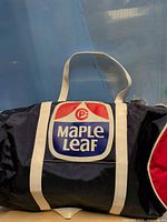 Front view showing Maple Leaf logo and handles