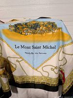 Full view showing Le Mont Saint Michel illustration and central text