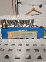 Snuffer on top of retail box