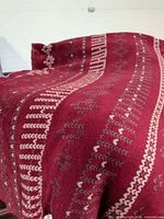 Front view showing patterned side of throw blanket