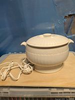 Overall view of ceramic electric soup tureen showing lid, handles, cord and pedestal base