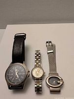 Group shot of all three watches upright