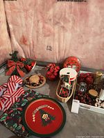 Overview of lot showing tray, bows, tablecloth, ribbons, faux flowers and greenery