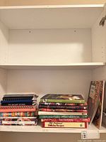 Two shelves showing entire lot of cookbooks