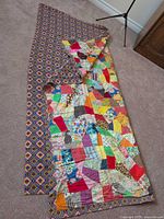 Full quilt front folded to show backing pattern