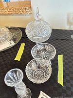 Group shot showing lidded candy dish, two small dishes, and bud vase