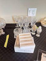 Group view of goblets, cream, sugar, salt & pepper, boxed knife rests
