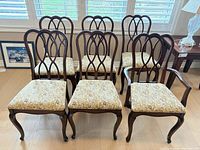 Front view of all six chairs showing design and upholstery