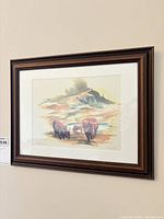 Full view of framed print on wall showing frame style and scale