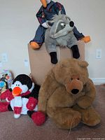 Group image of bear, raccoon, penguin, goose plush toys
