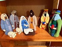 Group view of all knit nativity figures on shelf