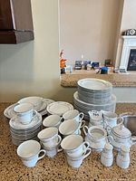 Full lot showing plates, cups, saucers, serve pieces