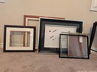 Group shot of all six frames leaning against wall