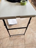 Top view of plastic folding table showing surface condition
