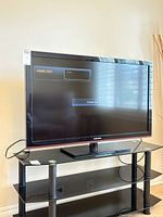 Front view of Samsung television showing screen on pedestal stand