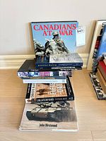 Front view of stacked war books showing titles and covers