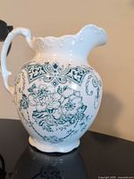 Full view of ceramic wash jug showing shape, pattern and handle