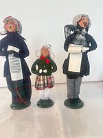 All three Byers' Choice caroler figurines on green bases