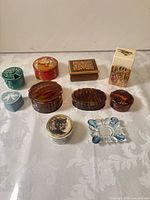 Group shot of all decorative boxes, ashtrays and tin