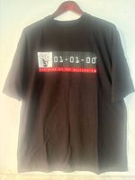 Front view of black 01.01.00 The Mark of the Millennium T-shirt