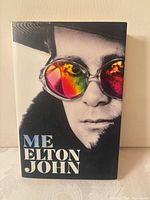 Front cover showing title and Elton John portrait