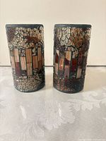 Front view of both cylindrical mosaic candle holders