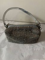 Front view silver rhinestone wristlet with wrist strap