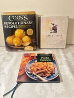 Front covers of all three hardcover cookbooks