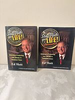 Front view of both paperback books upright