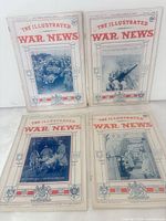 All four magazines laid flat showing covers