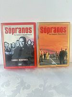 Front view of both Season 2 and Season 3 DVD box sets