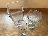 Group image showing all three clear glass vases