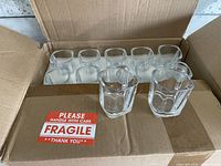 Open box showing multiple square shot glasses with two placed at front