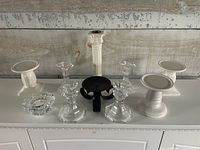 Group shot of all ten candle holders on surface