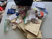 Overall lot showing bags, glue sticks, paint palette, paint pots and assorted craft pieces