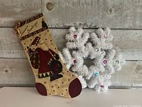 Both decorations side by side for scale and overall view