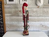 Front view showing full height, colors and base decorations