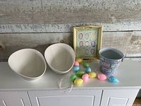 all items together: two ceramic bowls, tray, tin bucket, styrofoam eggs