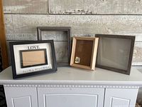 Group view of four frames and shadow boxes